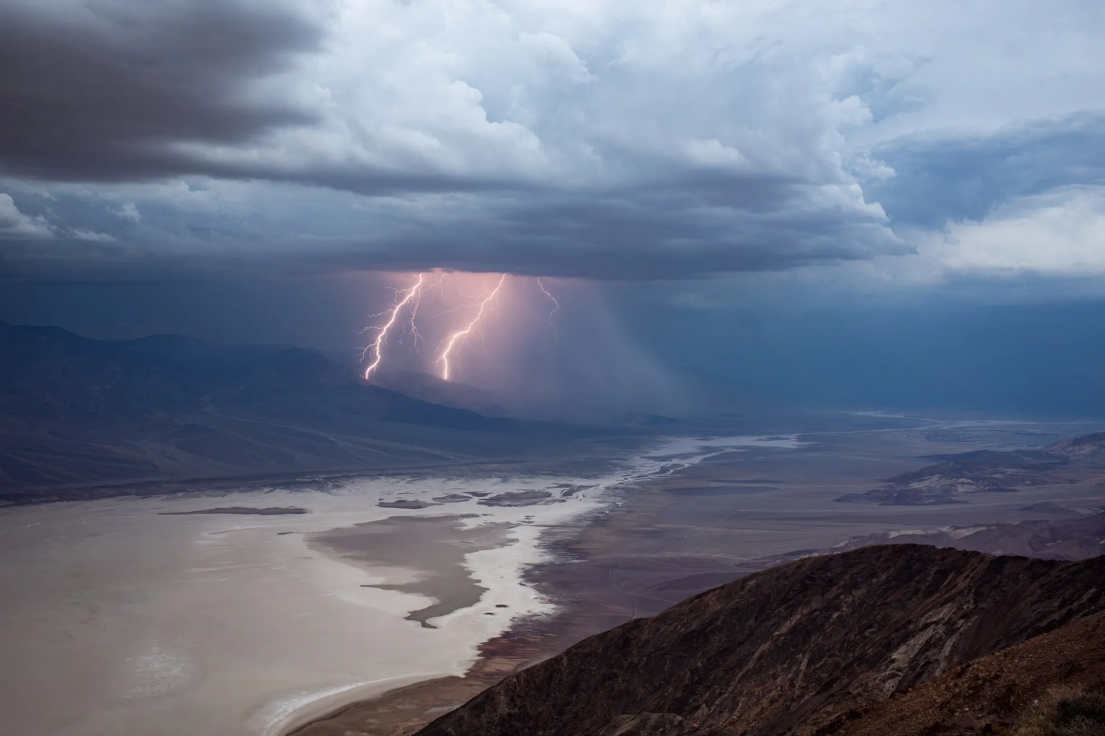 Scenic view of a lightning storm over Badwater Basin from Dante's View in Death Valley National Park, California, USA.